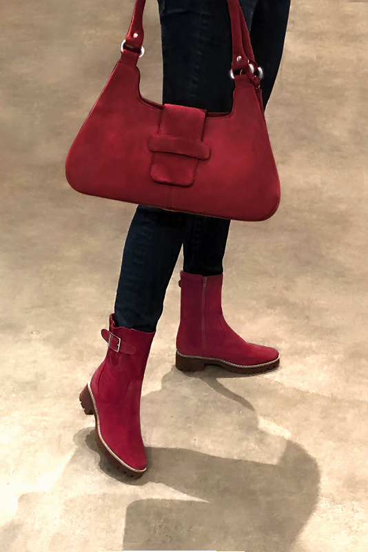Burgundy red women's ankle boots with buckles on the sides. Round toe. Low rubber soles. Worn view - Florence KOOIJMAN